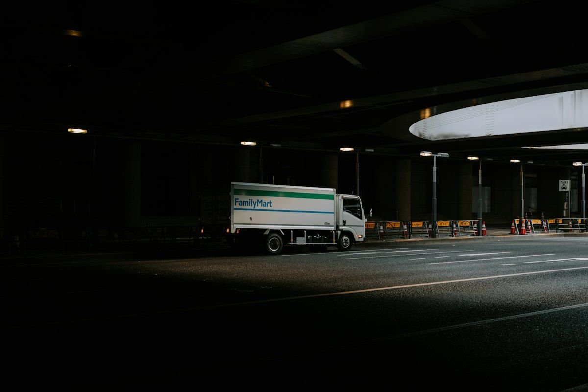 Delivery driver carrying a parcel to a customer